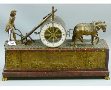 A good French gilt metal mantel clock having a ploughman and two horse team flanking a drum casing with spoke wheel blue and 