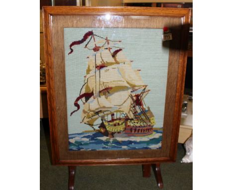 Oak firescreen with woolwork galleon