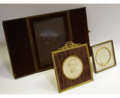 A leather bound travelling easel photo frame, velvet interior, gilt fitting by Walter Jones, Sloane Street, London, closed 25