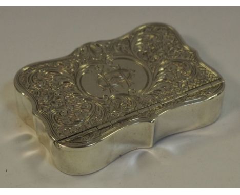 A Yates Brothers of Sheffield serpentine shaped silver snuff box, engraved with foliate scrolls, monogrammed cartouche 'CH' d