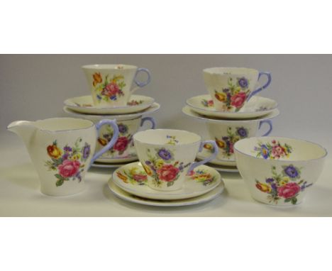 A Shelley Wild Flowers tea service, comprising four teacups, six saucers, six side plates, milk jug and sugar bowl, printed m