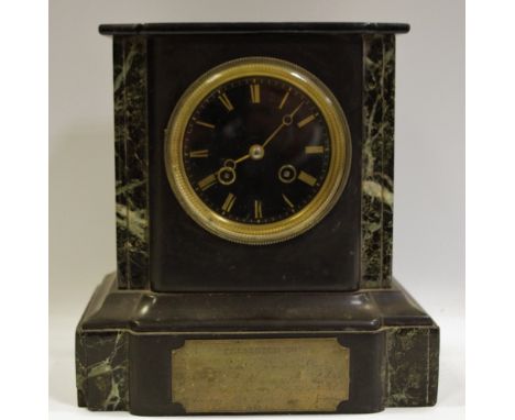 A Belge Noir mantel clock brass Roman numerals to dial flanked by variegated marble, plinth base