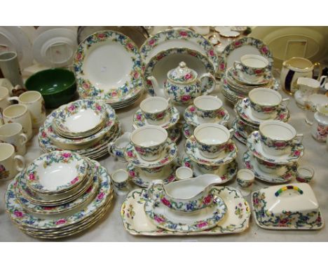 A Booth's Floradora part tea and dinner service comprising teapot, coffee pot, bowls, cups, saucers, etc