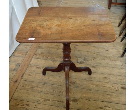 A Mahogany flip top side table on turned pedestal tripod support