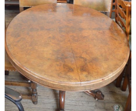 A Walnut loo table on tripod base