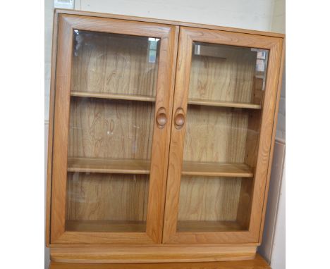 A light Ercol glazed bookcase