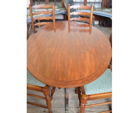 A Mahogany oval tilt top tripod table