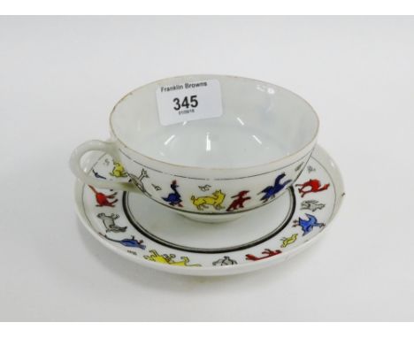 Porcelain cup and saucer with a frieze of coloured enamel cubist style painted animals, (2) 