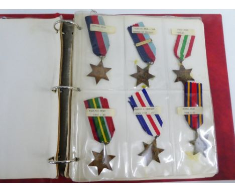 A Medal Album containing a quantity of 20th century medals and medallions to include WWI War, Victory and Mercantile, WWII De