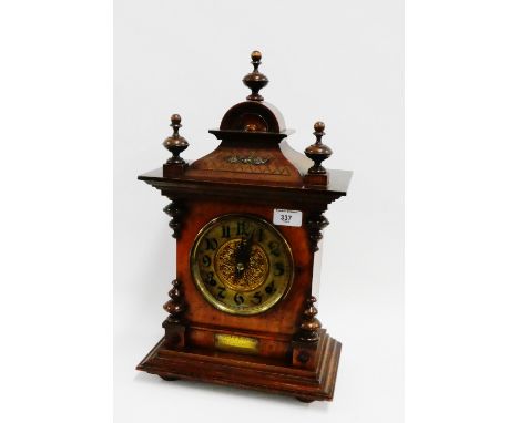 19th century walnut cased mantle bracket style clock, the domed top with turned finials over a brass dial with Arabic numeral