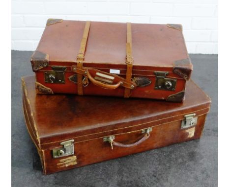 Two vintage brown leather suitcases, (2) 