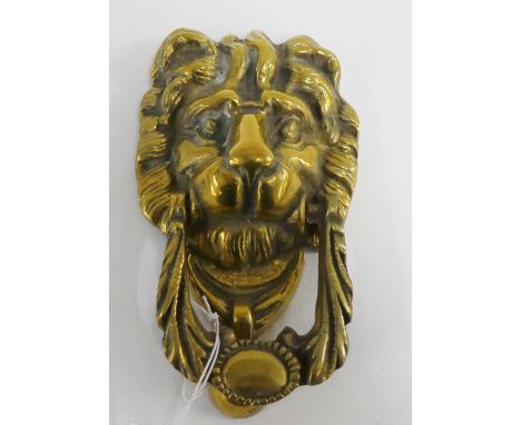 A brass lions mask head door knocker 18cm long 