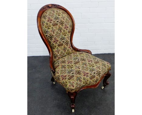 Mahogany framed and upholstered chair with foliate carved toprail, cabriole supports and ceramic castors,  92 x 62cm