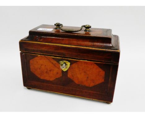 19th century mahogany and inlaid tea caddy the hinged lid with brass handle to top, opening to reveal three lead lined compar
