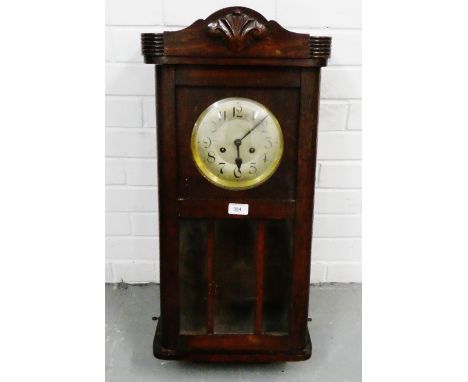 Oak cased wall clock, the silvered dial with Arabic numerals, complete with pendulum