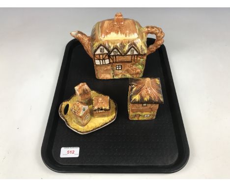 A Price Brothers cottage ware teapot together with a cruet set and preserve pot