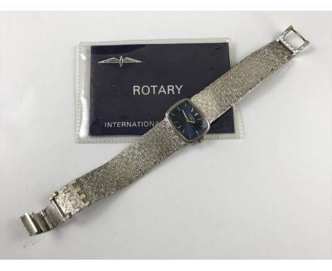 A 1970s lady's Rotary wristwatch, having a textured bracelet strap, rounded rectangular face and baton markers, together with