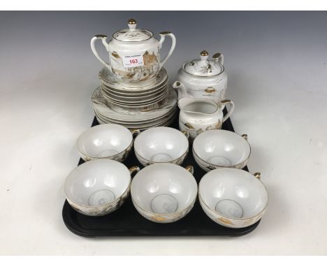 An oriental eggshell porcelain tea service for six, having lithophane bases depicting a geisha 