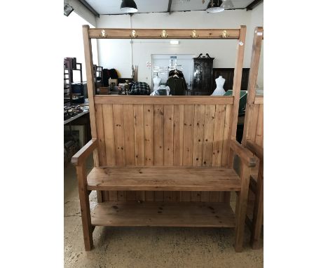 A contemporary bespoke pine settle with integral coat hooks and boot shelf, originally commissioned at a cost of £700, 127 cm