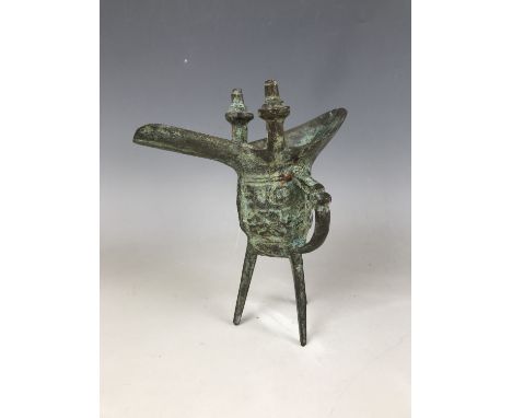 An archaic style Chinese bronze lamp / vessel 