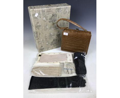 A vintage Harrods of London box containing a faux crocodile skin handbag and seven pairs of gloves, some in original packagin
