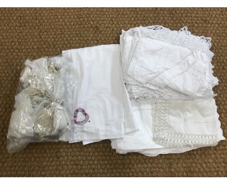 Vintage white-work table linens / cloths, together with a pillowcase embroidered with two love-hearts, and a quantity of lace