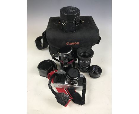 A cased Canon AV-1 camera together with a Clubman 1:2.8 F=28mm lens, two CFE Teleplus MC4 lenses, a Cokin light 55mm lens and