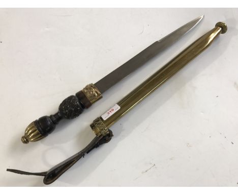 A dirk in brass scabbard