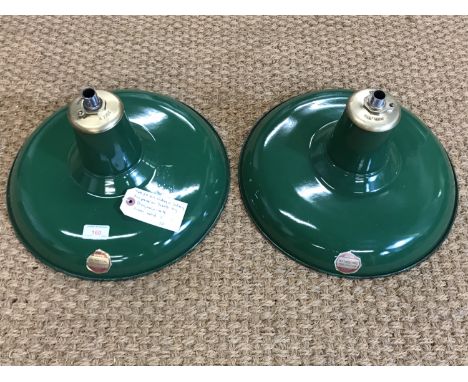 A pair of vintage Benjamin "Distributing Reflector" industrial pendant light shades, green enamelled, with original paper lab