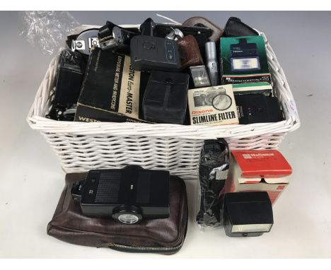 A large quantity of camera flashguns, light meters and filters etc