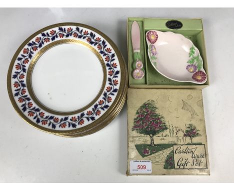 Six Wedgwood gilded and hand-enamelled tea plates, together with a boxed Carlton Ware butter dish and knife