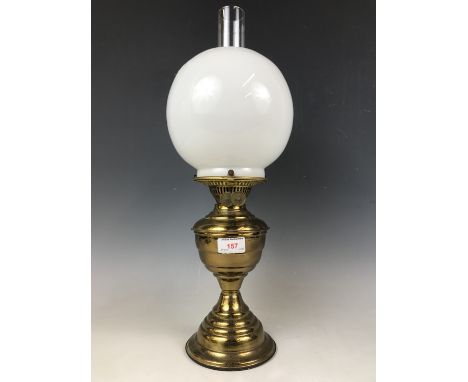 An early 20th Century Samuel Heath and Sons brass oil lamp with duplex burner, glass funnel and shade, 49 cm