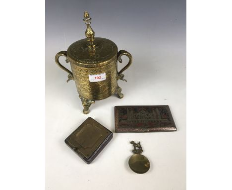 A Moradabad cigarette case, together with an Indian brass canister and a caddy spoon with 'Smooth Haired Fox Terrier' termina