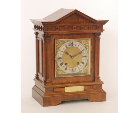 A late 19th Century architectural eight day strike mahogany mantle clock with Roman numerals to a silvered chapter ring and b