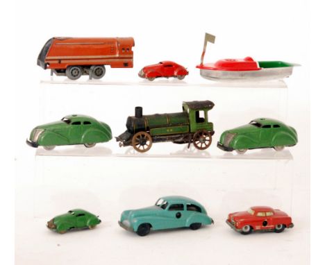 Two Schuco 3000 clockwork sedan cars, two similar Minic cars, a Pocketoy sedan car in turquoise blue, a small tinplate boat, 