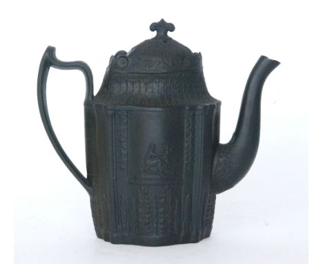 An early 19th Century black basalt Castleford type coffee pot and cover, the body and hinged cover decorated in low relief wi