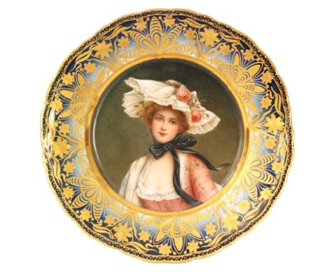 A 19th Century Vienna porcelain cabinet plate decorated to the centre with a hand painted portrait of a fashionable lady, sig