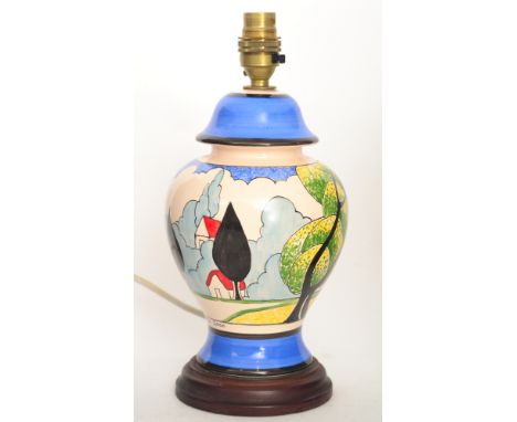 A contemporary Bizarre Craft pottery lamp base od baluster form by Rene Dale hand painted in the May Ave pattern after Claric