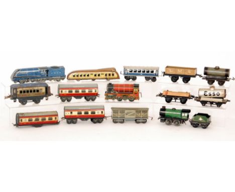 A Wells Brimtoy LNER locomotive and coach, three Chad Valley coaches, one lacking wheels, a British made George V tinplate cl