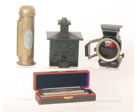 A cast iron Bank money box , a cycle lamp, a Hohner super Chromonica and a Glo-Glo Harmonica (4)