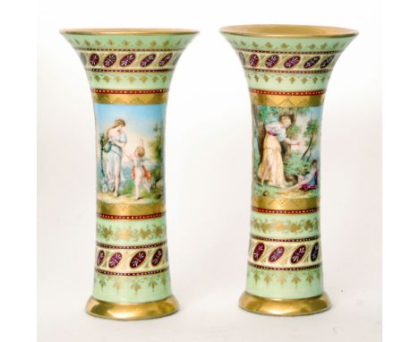 A pair of late 19th to early 20th Century Vienna type trumpet vases, each decorated with a hand painted cartouche within a gi