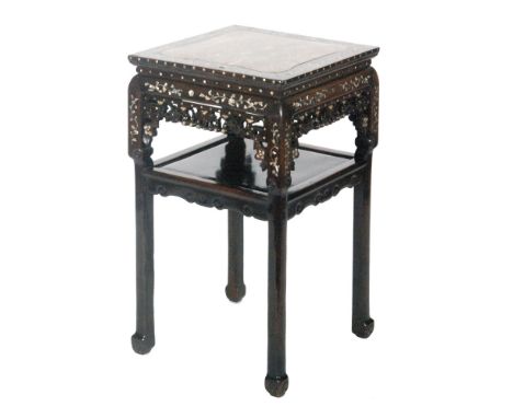 An early 20th Century Oriental Export hardwood jardiniere stand or occasional table of square form, with an inset rouge marbl