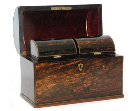 A 19th Century coromandel tea caddy the domed top opening to reveal two divisions each with covers below a velvet plush lined