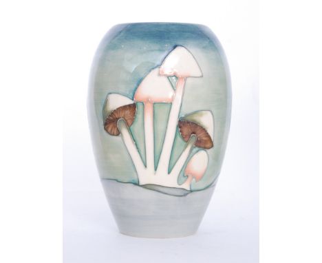 A Moorcroft Pottery vase decorated in the Fairy Ring pattern designed by Phillip Richardson decorated with tubelined toadstoo