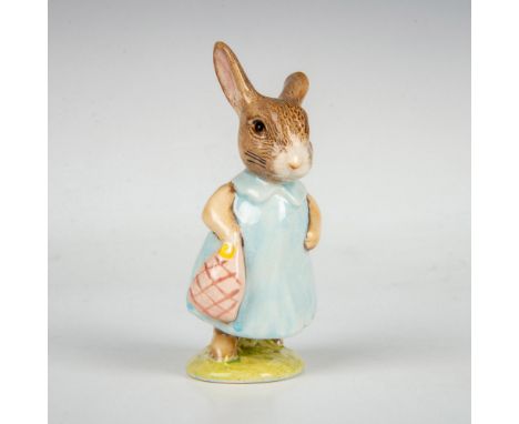 Modeled with brown fur, light blue dress and pink bag. This item has its original box measuring 3"L x 3"W x 4.25"H. Beswick a