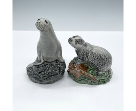 This glossy porcelain duo includes two adorable animals that once held once held fine Scotch whisky and now stands as delight