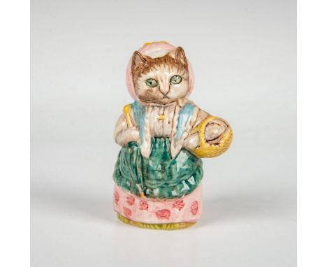 Cat modeled with green apron, pink hat and dress and holding a yellow basket. This item has its original box measuring 3"L x 