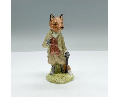 Fox figurine dressed in a beige coat and shorts leaning on a cane. Royal Albert backstamp. This item has its original box. Bo