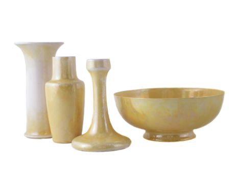 Four pieces of yellow glazed Ruskin, to include two vases, a bowl and a candlestick, (4) the tallest item measures 20cm high 