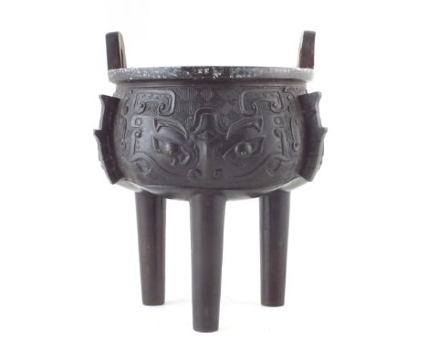 Chinese bronze archaic style ding censor, with twin handles, 17th /18th century, 18cm high CONDITION REPORT: No obvious signs